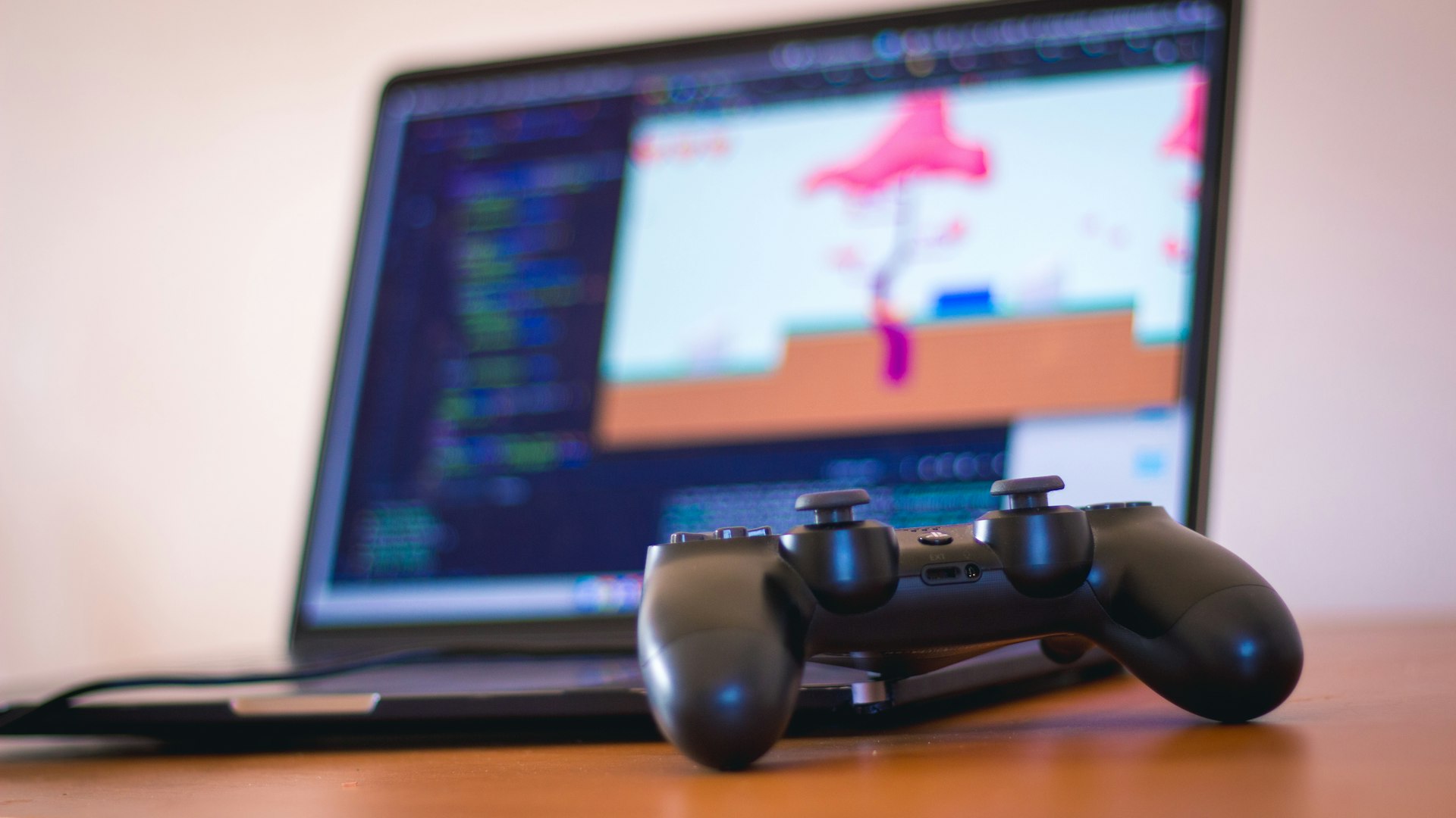 A dim gaming setup glowing with slate-blue light